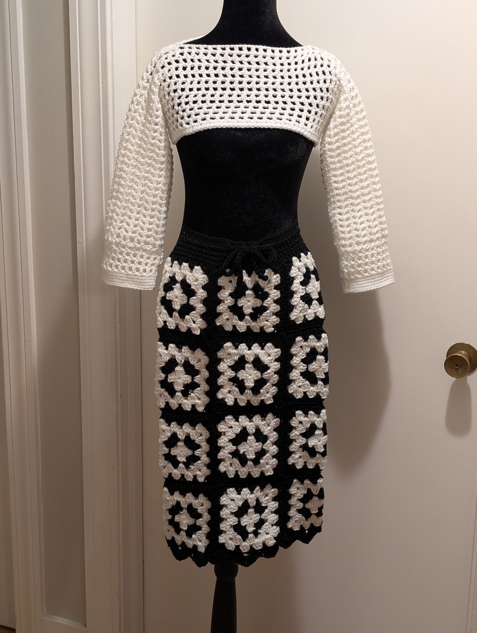 Lola cream crochet top and black-and-cream granny-square skirt